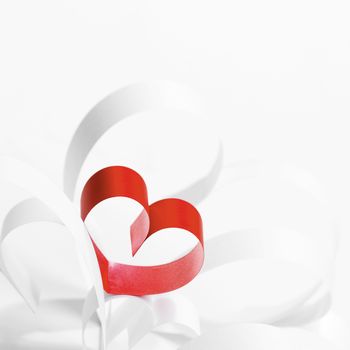Red hearts of ribbon on white background