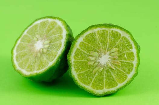 Bergamot, kaffir lime isolated green background.