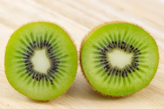 Fresh kiwi fruits on wooden. Wood background.