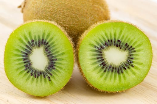 Fresh kiwi fruits on wooden. Wood background.