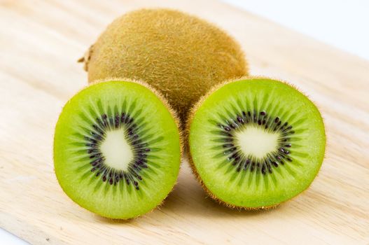 Fresh kiwi fruits on wooden. Wood background.