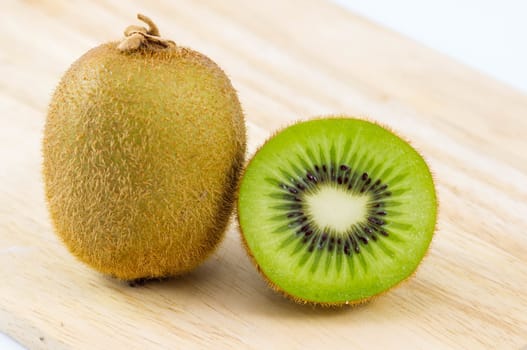 Fresh kiwi fruits on wooden. Wood background.