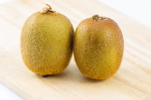 Fresh kiwi fruits on wooden. Wood background.