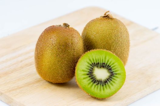 Fresh kiwi fruits on wooden. Wood background.