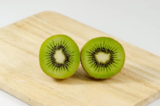 Fresh kiwi fruits on wooden. Wood background.