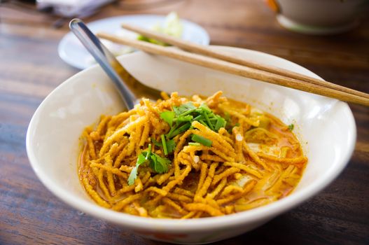 Noodle with minced pork on wooden table