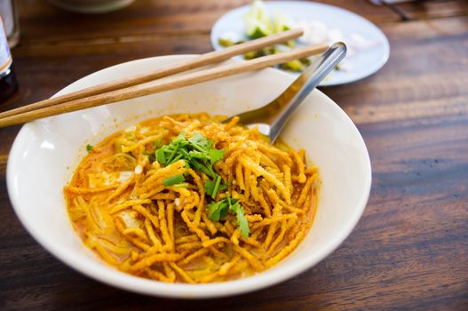 Noodle with minced pork on wooden table