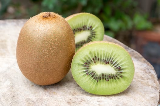 Kiwi fruit on wooden background.