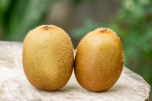 Kiwi fruit on wooden background.