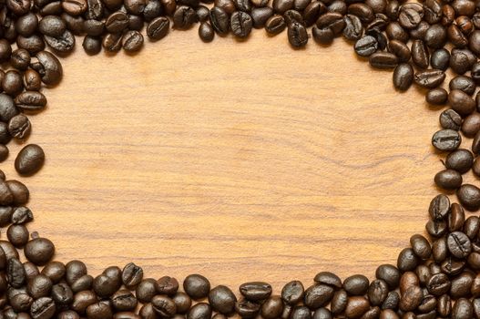 Coffee bean on wooden background.