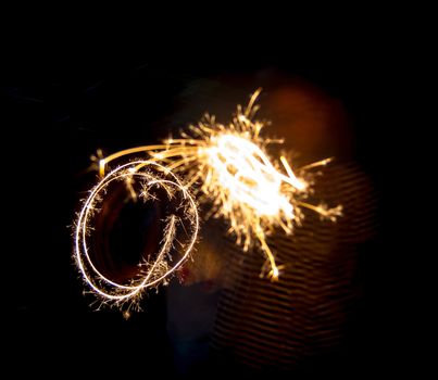 New year party sparkler on blur children background
