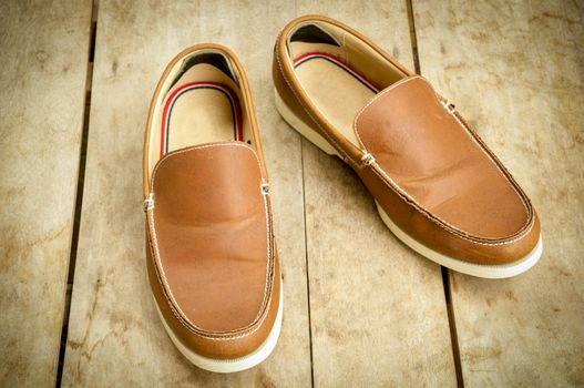 men's leather shoes on wood.