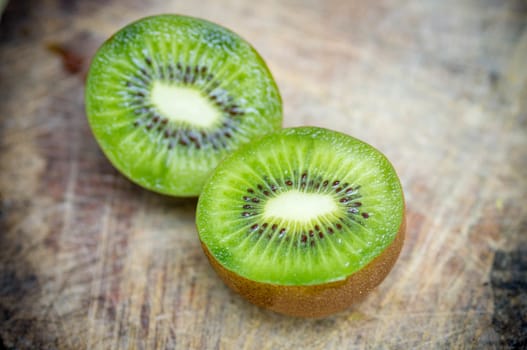 Kiwi fruit on wooden background