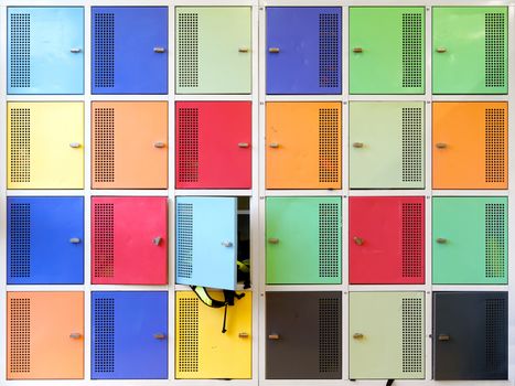 Photo of colorful lockers in a high school as a background.
