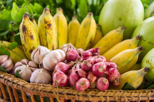 Fruits and vegetables  bananas onion and garlic arranged in a group, natural still life for healthy food.