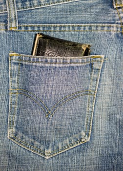 Close up blue jeans pocket with wallet.