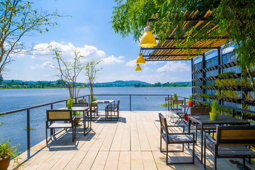 Outdoor restaurant with beautiful view on Lake in Thailand.