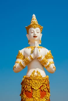 Thai graven image on blue sky background.