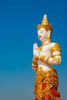 Thai graven image on blue sky background.