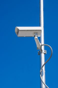 Security camera with blue sky