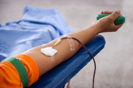 Closeup of blood donor at donation.