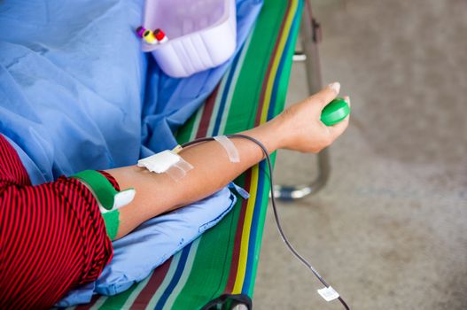 Closeup of blood donor at donation.