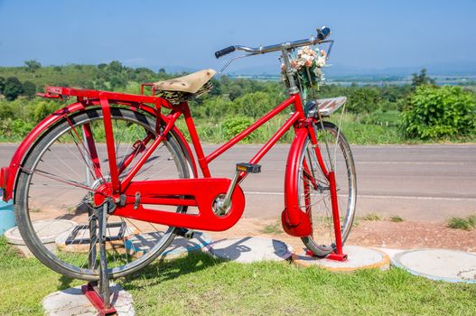 Bicycle parked with blue sky.