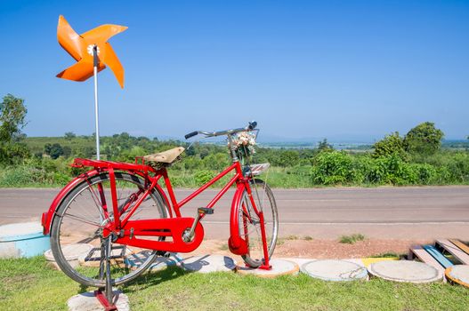 Bicycle parked with blue sky.