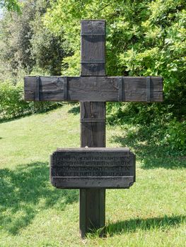 Cross in the German cemetery of Costermano, Italy. On the plate the inscription: "To our fallen comrades and in honor of all the soldiers who died."