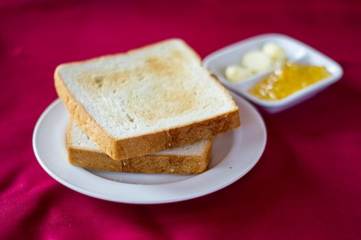 Bread with butter on the disk.