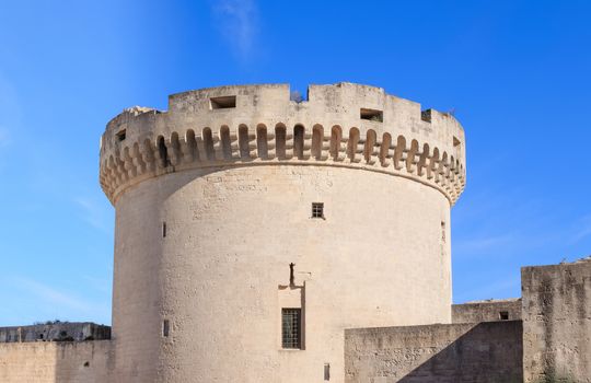 ruins of medieval old tower of castle under blue sky in Matera Italy