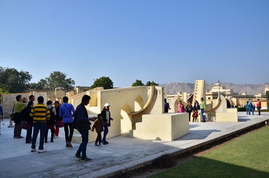 Jaipur, India - December 29, 2014: people visit Jantar Mantar observatory on December 29, 2014 in Jaipur, India. The collection of architectural astronomical instruments, were built by Sawai Jai Singh II in 1727-1734.