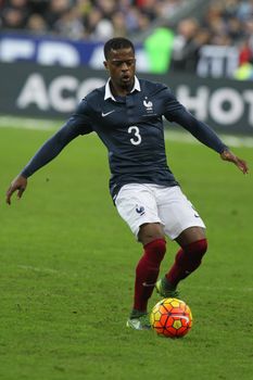 FRANCE, Paris: Patrice Evra of France kicks the ball during an international friendly soccer match between France and Germany at the Stade de France in Paris on November 13, 2015. At least 100 people are reported to have died in multiple shootings and explosions across Paris on Friday night, including a reported suicide blast which killed three outside the Stade de France. As news emerged of events outside, French President Francois Hollande, in attendance at the match, was able to leave safely while thousands of fans flooded onto the pitch before being evacuated by police. 