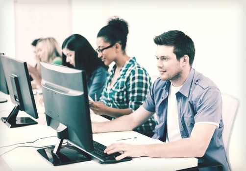 education concept - student with computer studying at school