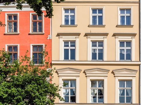 Facades of ancient tenements in the Old Town in Krakow, Poland.