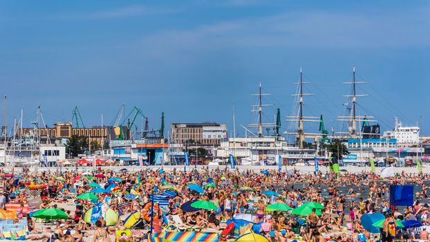 Municipal beach in Gdynia, city in the Pomeranian Voivodeship with the third largest seaport in Poland specialized in handling containers, ro-ro and ferry transport.