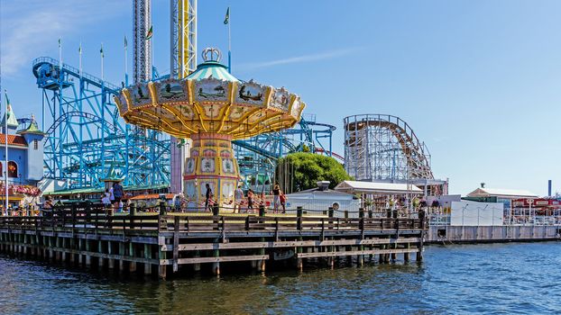 Merry-go-round in Grona Lund amusement park on the Djurgarden island in Stockholm. The park is located among the old 19th century buildings originally designed not for the park.