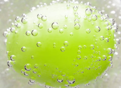 The photo depicts the grapes in the bubbles