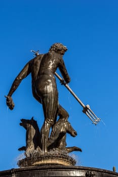 Close-up of Neptune's Fountain, in the center of Dlugi Targ (the Long Market) in Gdansk, Poland. Statue of Roman god erected in 1549 is a symbol of the city and its most recognizable landmark.