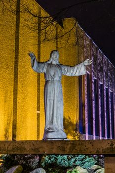 Night view of Jesus Christ statue in fornt of the church in Katowice, Poland.