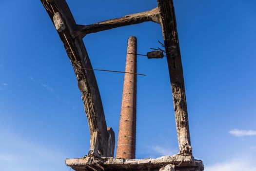Factory chimney in the area of the ruined Uthemann Ironworks in Katowice, Poland