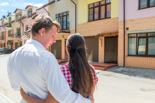 loving married couple looking at their new home