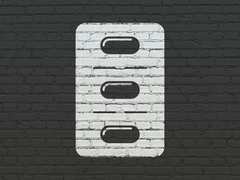 Medicine concept: Painted white Pills Blister icon on Black Brick wall background