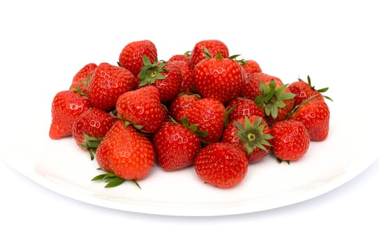fresh garden strawberries on a white plate