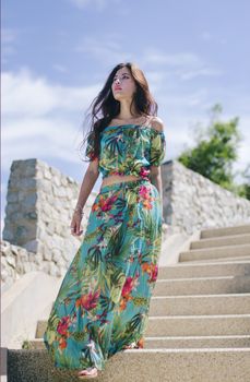 Bohemian girl walking on the white step