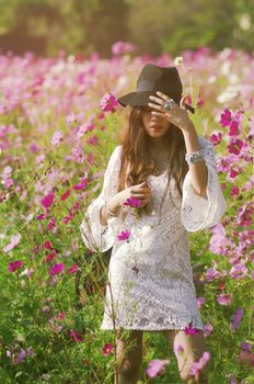 White dress lady in purple cosmos field