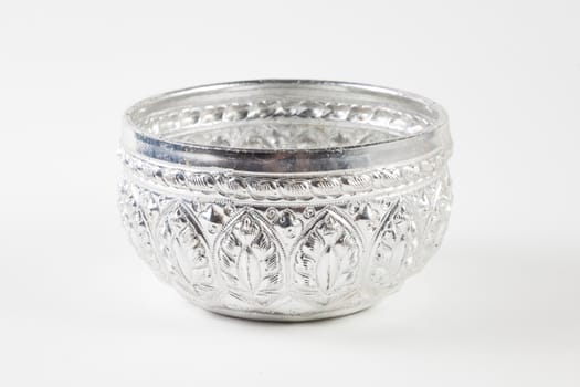 Decorated pattern silver bowl on white, isolated