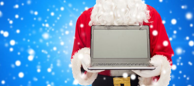christmas, advertisement, technology, and people concept - close up of santa claus with laptop computer over blue snowy background