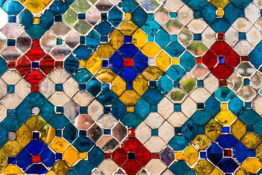 Close up of the wall of The Wat Phra Kaew, Temple of the Emerald Buddha in Bangkok, Thailand.