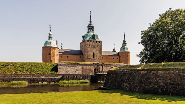 Front view on Kalmar Castle with the moat and bascule bridge. The castle dates back 800 years, reached current design during the 16th century, when rebuilt by Vasa kings.